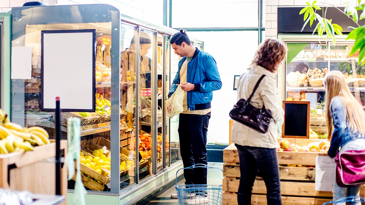 customers buying groceries at a market