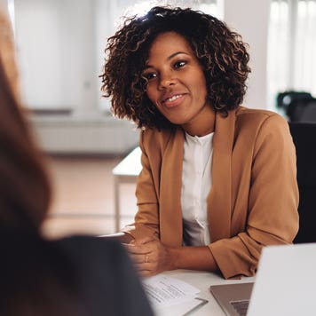 two women discussing finances