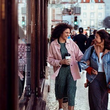 two young women walking in a European city