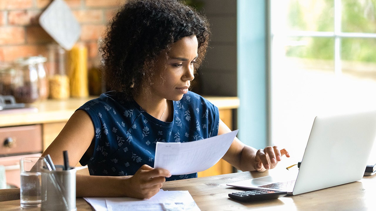 woman working on financial paperwork