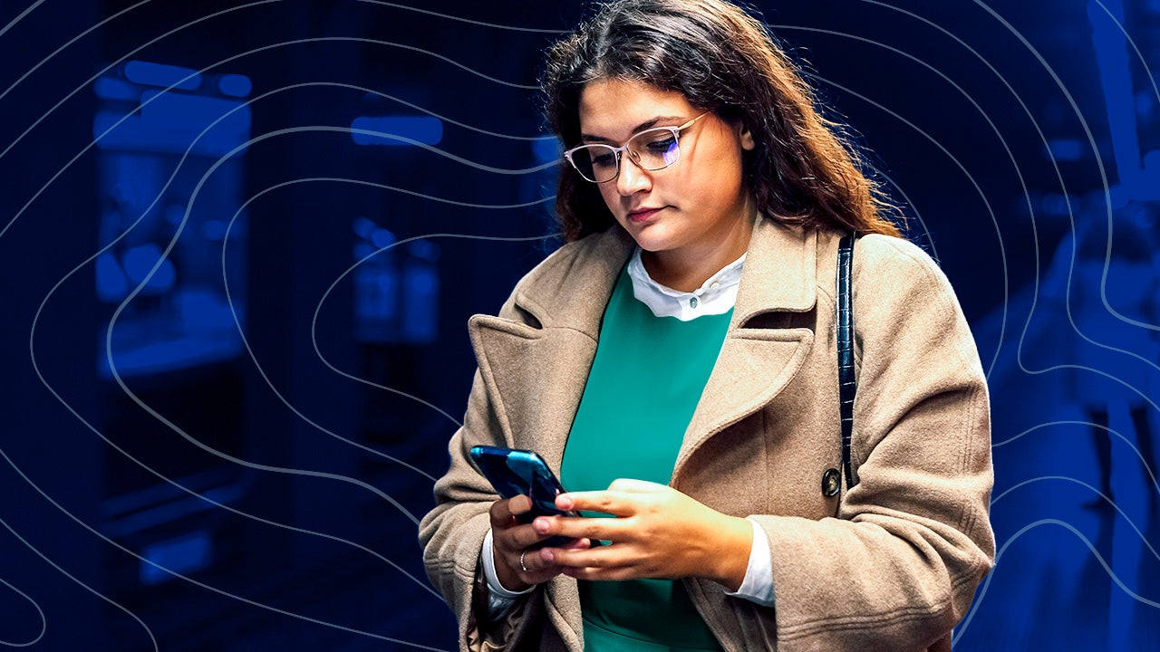 woman looking at cell phone