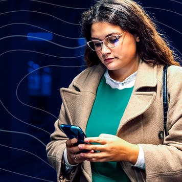 woman looking at cell phone