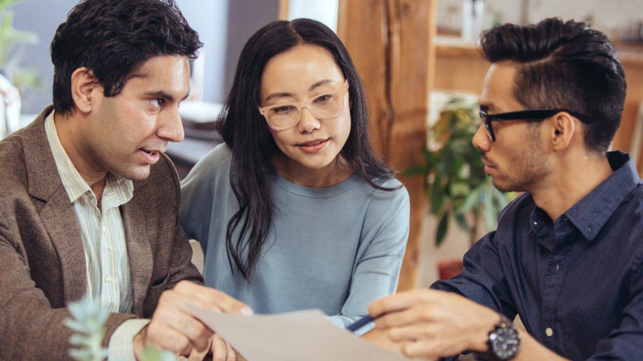 Three people discussing homeownership options