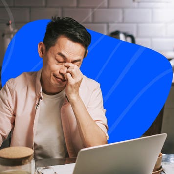 Illustration of person at a kitchen table frustrated over finances