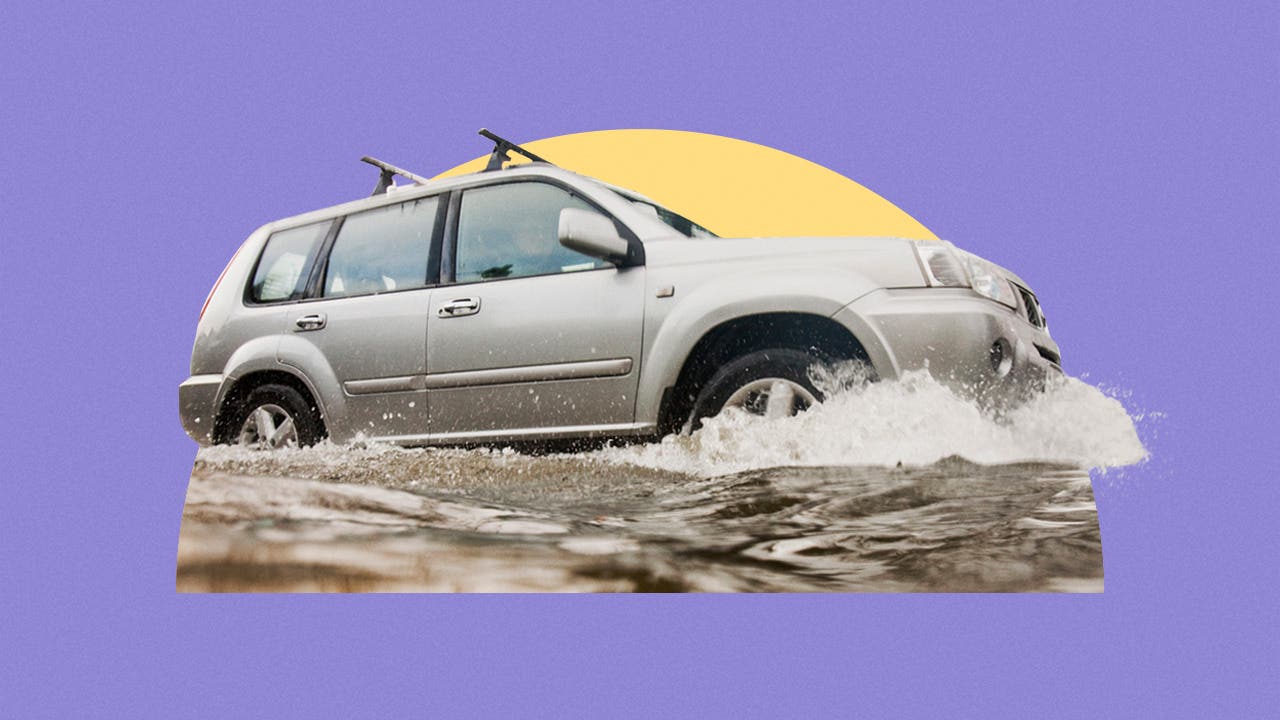 Car driving through flooded area