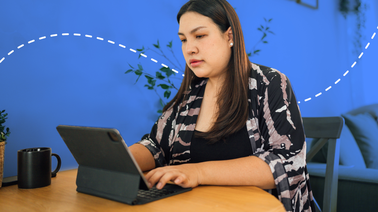 Asian women using laptop computer at home working space.