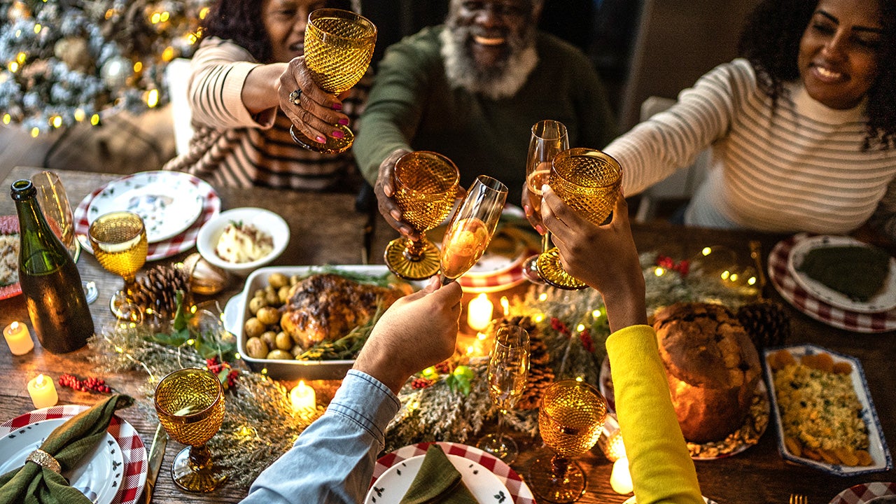 Family toasting on Christmas dinner at home