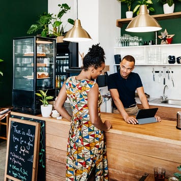 young person checking out a business