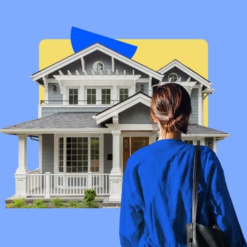 common home styles - woman looking at victorian house