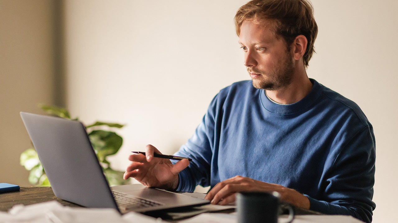 man checking his computer