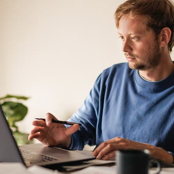 man checking his computer