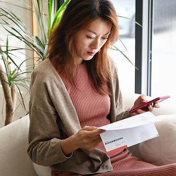 woman looking at paperwork