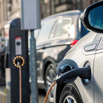 Charging an electric car in public station by the street, The Netherlands