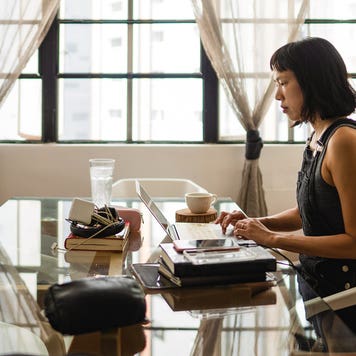 woman working on her laptop at home