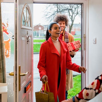 visitors arriving at a house for Christmas