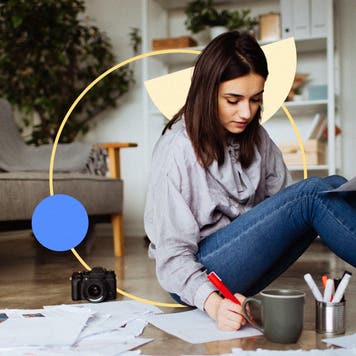 Woman sitting on a floor with many documents