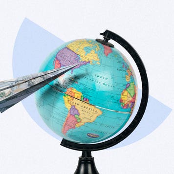 Globe and paper air plane