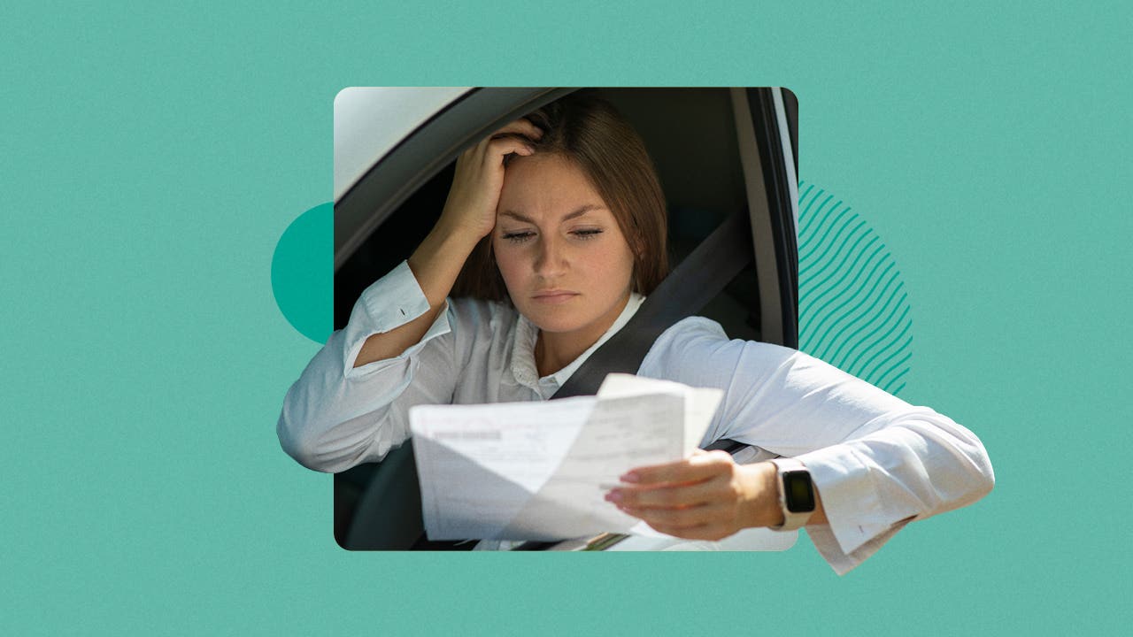 woman scratching head at paperwork