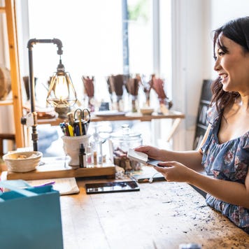 couple making a purchase at a female owned small business
