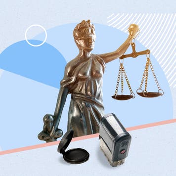 Image of statue holding scales and notary tools