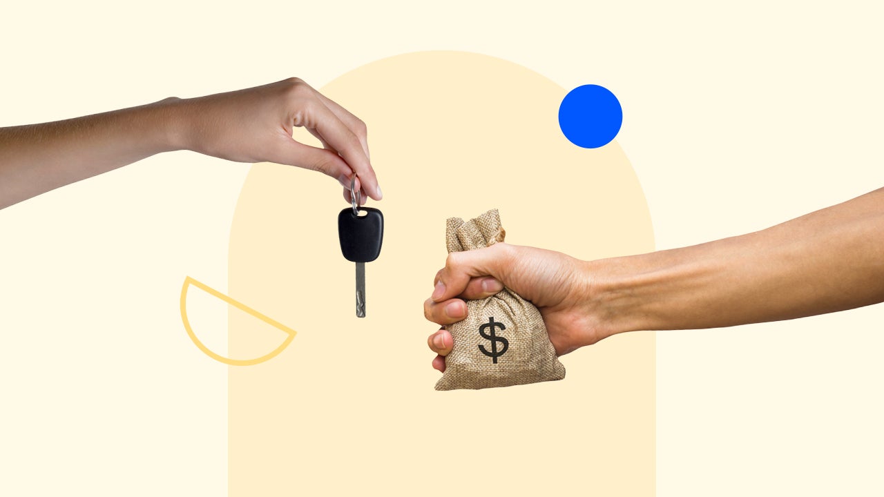 Hands trading a car key for money