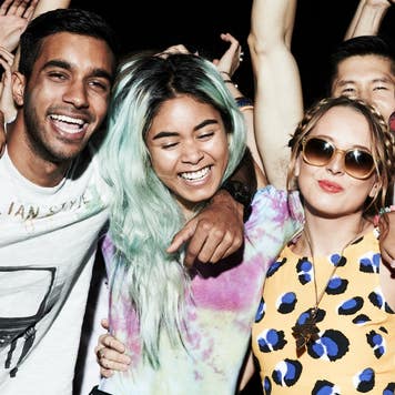 A group of three friends having fun at a concert.