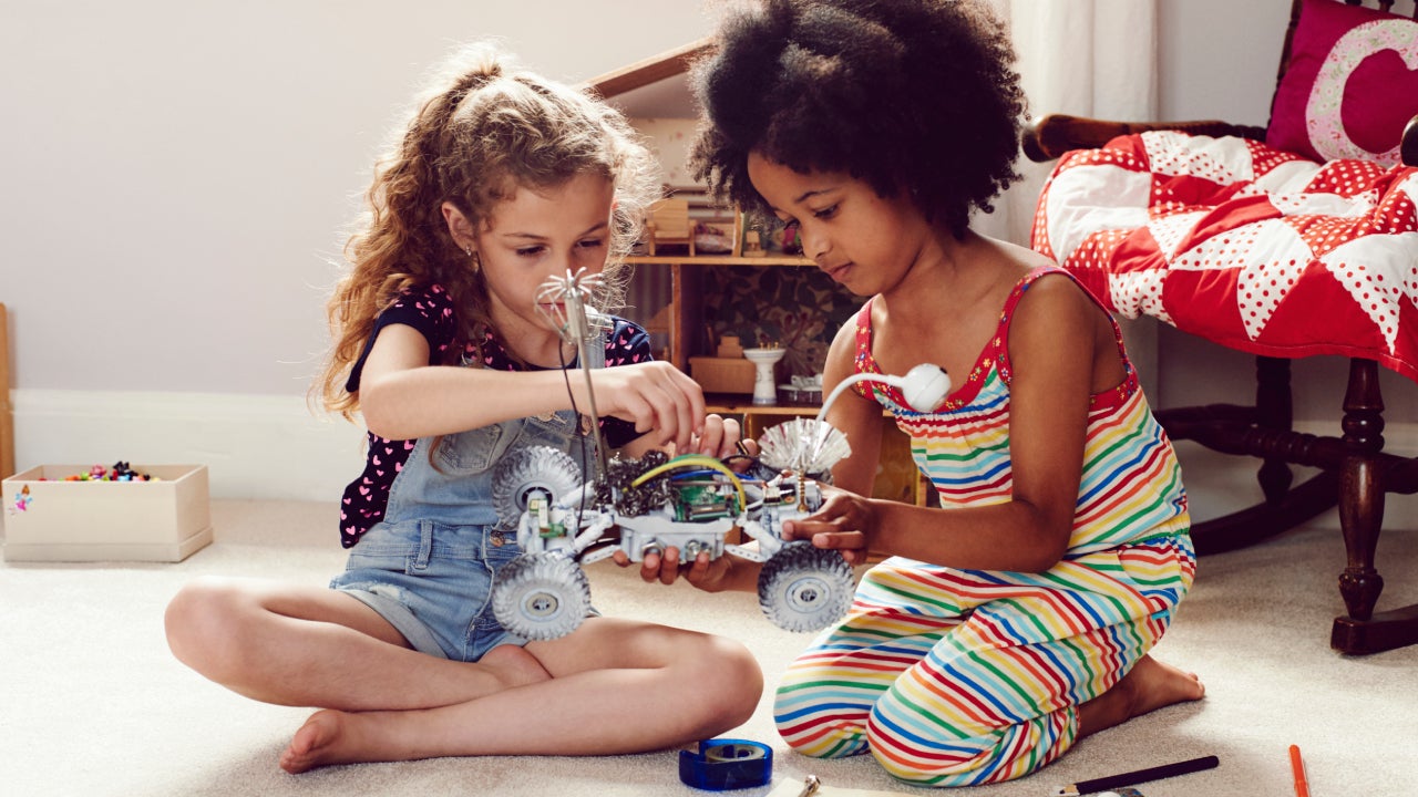 Two children working together to make things