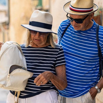 Senior tourist couple discovering missing wallet