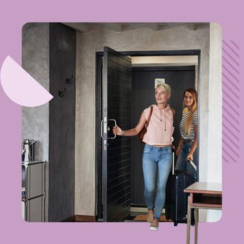 Two women entering a home