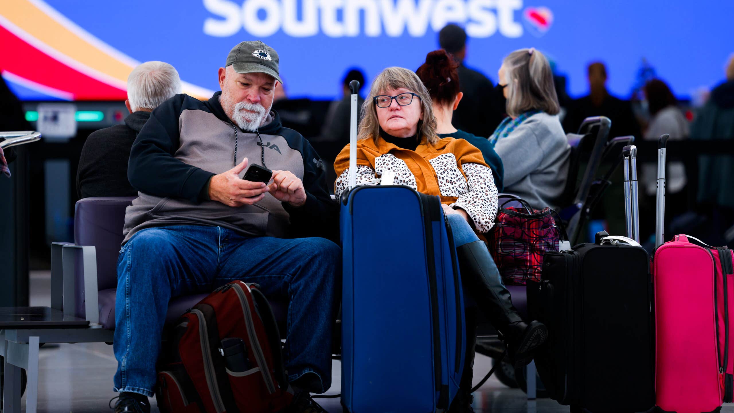 Couple sitting in an airport terminal