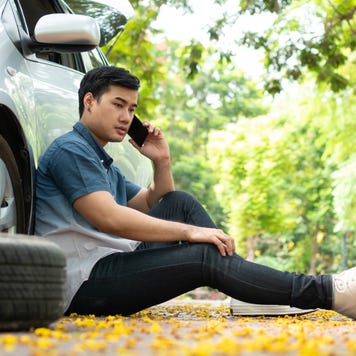 Full Length Of Young Man Sitting In Car - stock photo