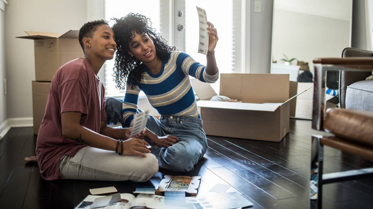 Lesbian couple picking paint colors for new home