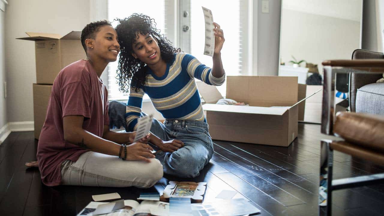 Lesbian couple picking paint colors for new home