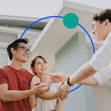 Image of a couple shaking hands with a realtor handing them keys with illustrated graphic features