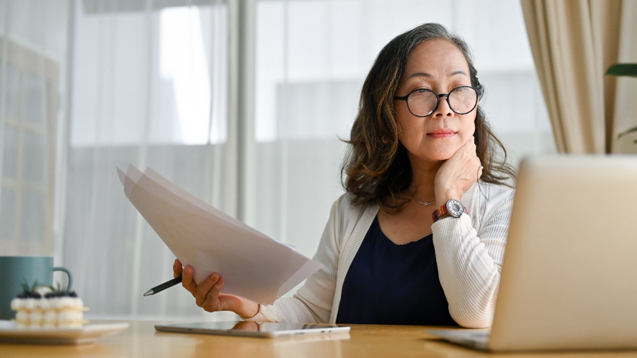 Concentrated businesswoman using portable computer