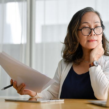 Concentrated businesswoman using portable computer