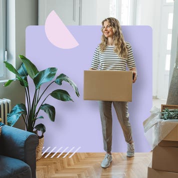 Woman carrying a box into a room
