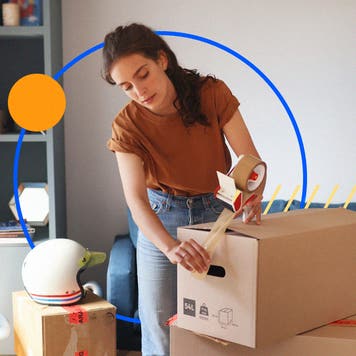 Woman using packing tape to seal boxes