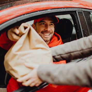 Person delivering food to a customer.