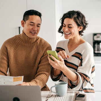 couple in the kitchen with bills