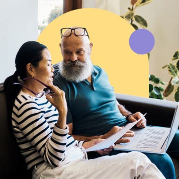 Couple discussing finances on a couch