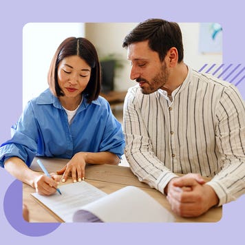 Two people reviewing documents