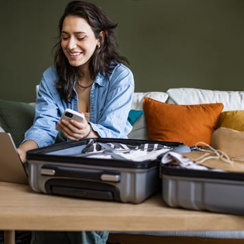 Woman using laptop to book travel reservation