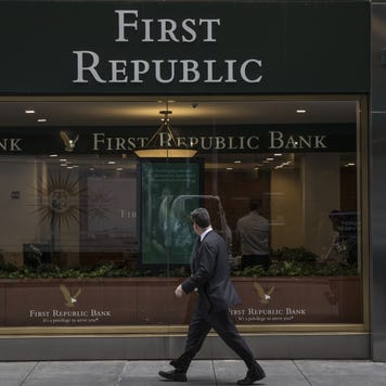 A pedestrian passes in front of a First Republic Bank