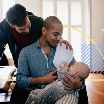 A gay couple taking care of a baby.