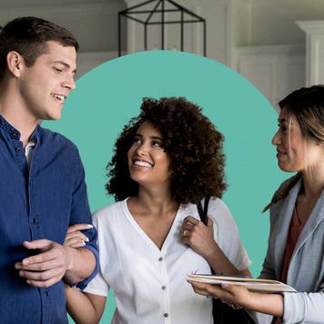 Couple chatting with a real estate agent