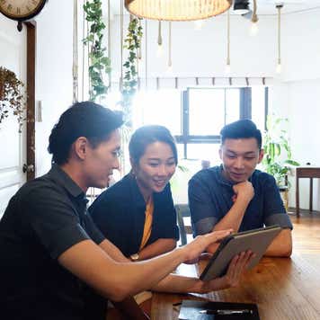 Young couple with a financial advisor at home