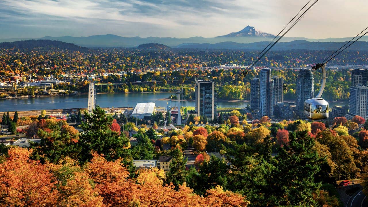 View of Portland skyline. Portland Aerial Tram and Mt. Hood on the background.