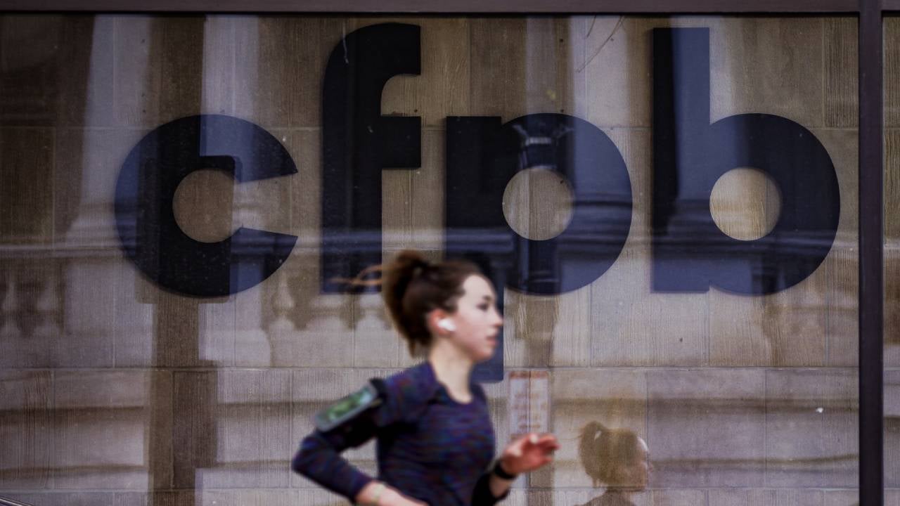 A jogger runs past CFPB building