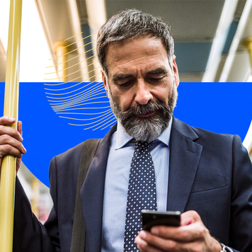 design element including an older man holding on to a pole and on his cellphone riding transit